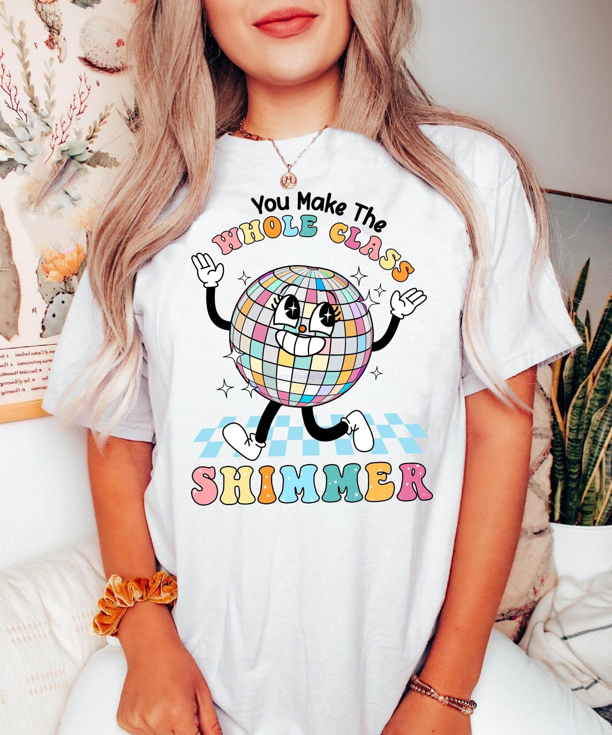 The words WHOLE CLASS SHIMMER arc over a sparkling disco ball character, whose hands and feet are playfully positioned to add movement and energy, celebrating the lively spirit of a harmonious class.