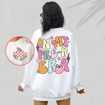 A bright and cheerful depiction of the early teaching experience, the design spells out IN MY PREK TEACHER ERA in lively, mismatched letters, complemented by icons of creativity like a paintbrush, a beaming palette