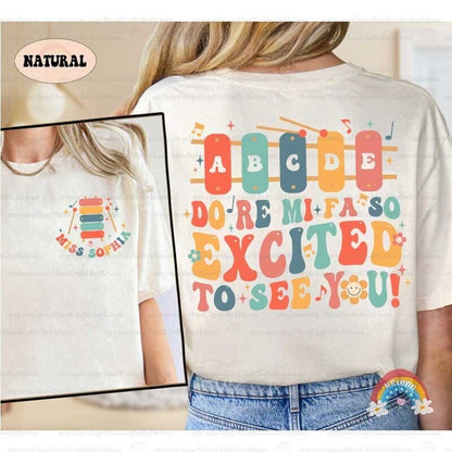 Colorful text graphic with musical notes and whimsical elements.
Words &quot;DO RE MI FA SO EXCITED TO SEE YOU!&quot; using a mix of uppercase letters in various colors.
Friendly and cheerful style, suitable for educators or music enthusiasts.