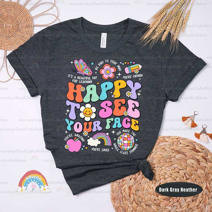 The phrase HAPPY TO SEE YOUR FACE pops in a fun array of vibrant colors, accompanied by delightful illustrations like a smiling flower face, a whimsical rainbow, and a colorful butterfly, evoking a sense of joyful greeting and creativity.