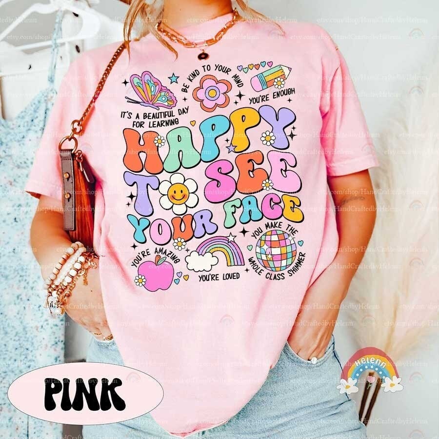 A vibrant and welcoming design featuring the phrase HAPPY TO SEE YOUR FACE with each letter uniquely colored and adorned with delightful motifs such as butterflies, flowers, and a cheerful sun.