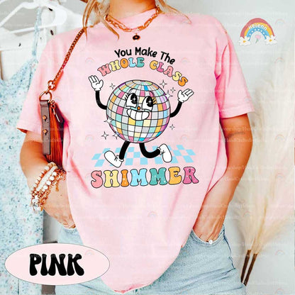An exuberant disco ball character, complete with a beaming smile and hands giving peace signs, is complemented by the phrase WHOLE CLASS SHIMMER presented in an array of soft, cheerful colors, emphasizing a bright and inclusive classroom atmosphere.