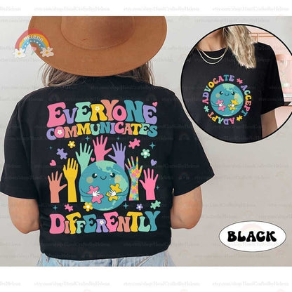 The illustration encapsulates the beauty of diverse interactions with a central globe character piecing together puzzles, encircled by a variety of vibrant hands reaching in, all beneath the guiding words EVERYONE COMMUNICATES DIFFERENTLY