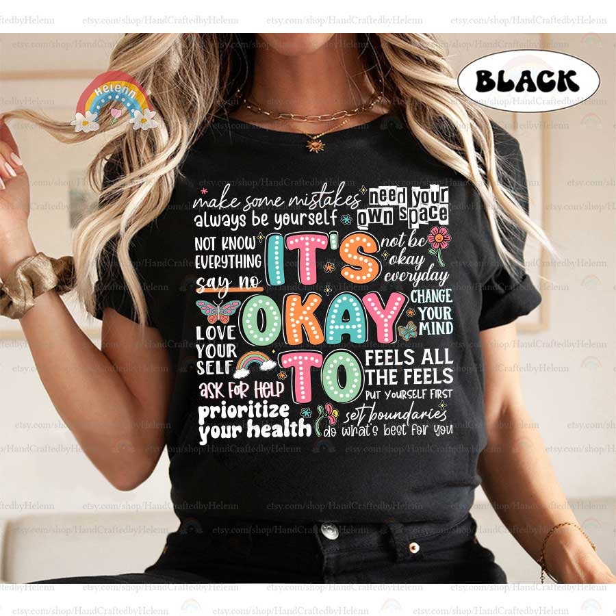The playful design spells out It&#39;s Okay To with each letter dotted in vibrant shades, mingled with symbols of hope and change, including a rainbow and butterfly, reinforcing the notion that it’s alright to ask for help and embrace change.