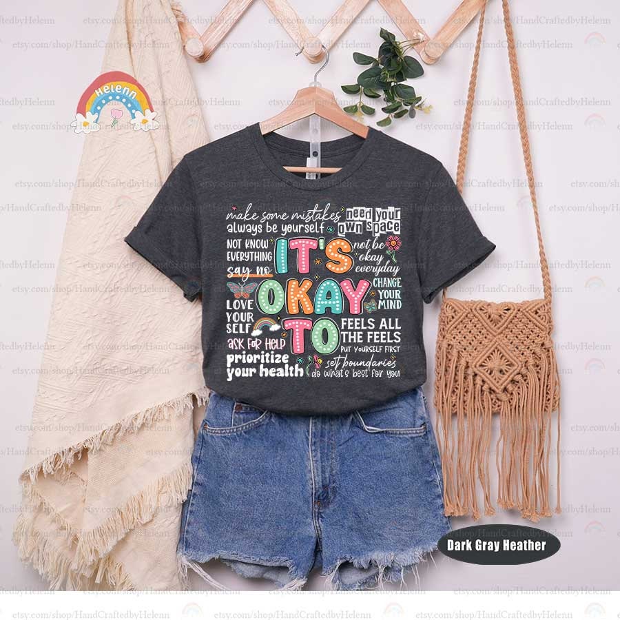 This graphic radiates kindness, with It&#39;s Okay To written in colorful dots, and paired with a gentle encouragement to Change Your Mind, flanked by a friendly butterfly and flower, symbolizing transformation and self-compassion.