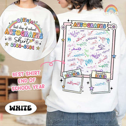 An endearing white shirt serves as a canvas for farewell messages, featuring a cheerful rainbow and vibrant text, marking the closure of the school year with special spots for educators and friends to leave their mark.