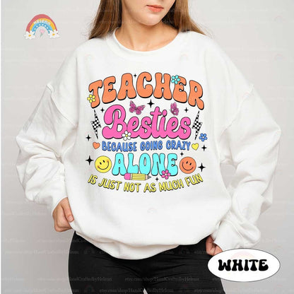 TEACHER BESTIES in vibrant lettering, accompanied by joyful motifs 
 underscoring the message that facing challenges is more enjoyable with friends, indicated by the phrase BECAUSE GOING CRAZY ALONE IS JUST NOT AS MUCH FUN.
