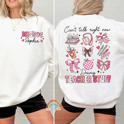 An affectionate tribute to teaching, the graphic features the phrase TEACHER STUFF beneath a collection of charming illustrations, including a polka-dotted apple and pink-hued classroom items.