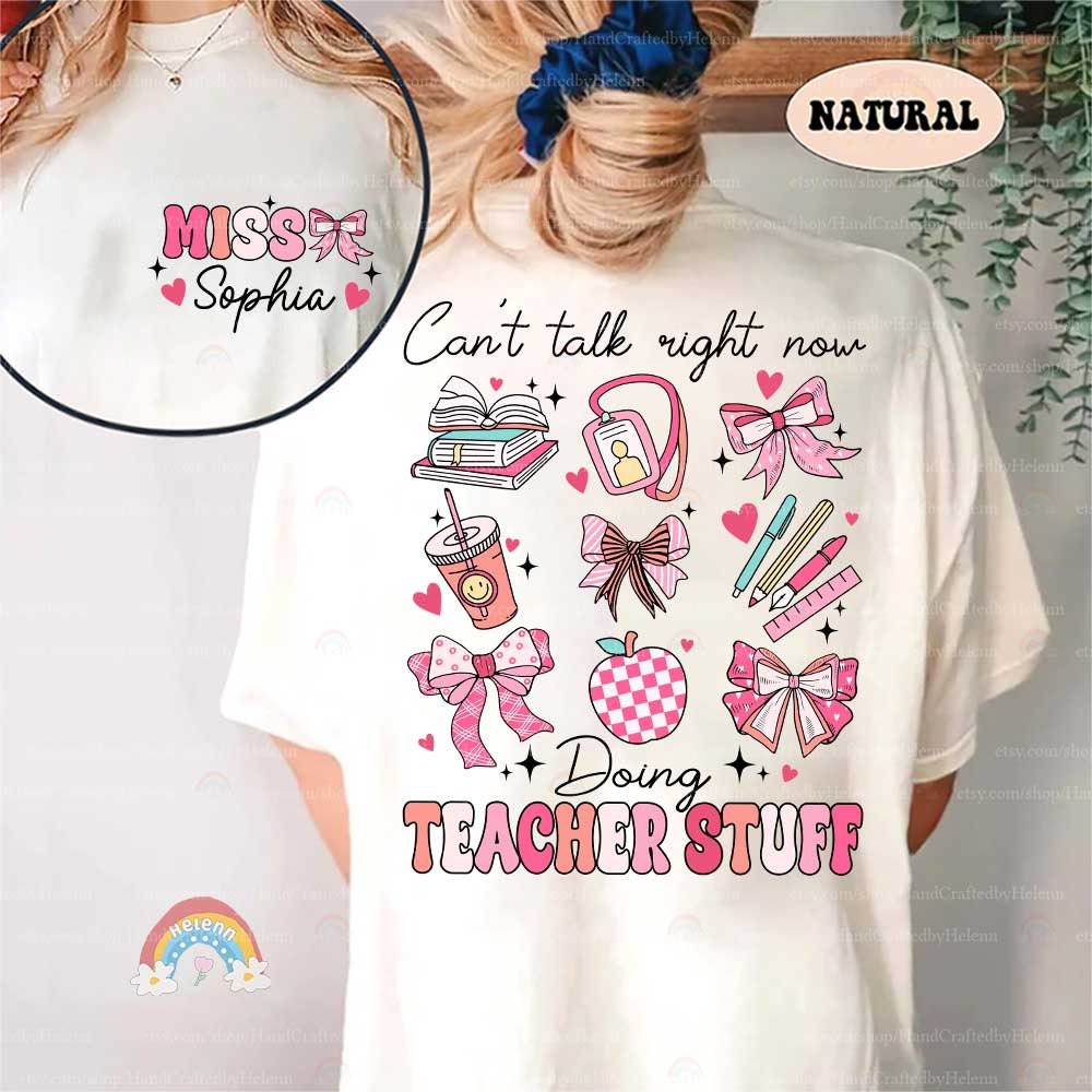 This image captures the essence of a teacher&#39;s day with a fun array of items like a gingham apple, a pair of open books with fluttering hearts, and an adorable ID badge, all set above the words TEACHER STUFF.