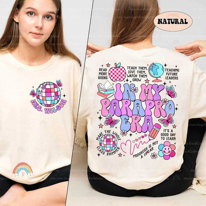 A vibrant and colorful design celebrating the paraprofessional era in education, adorned with playful symbols such as butterflies, a globe, and a smiling flower.