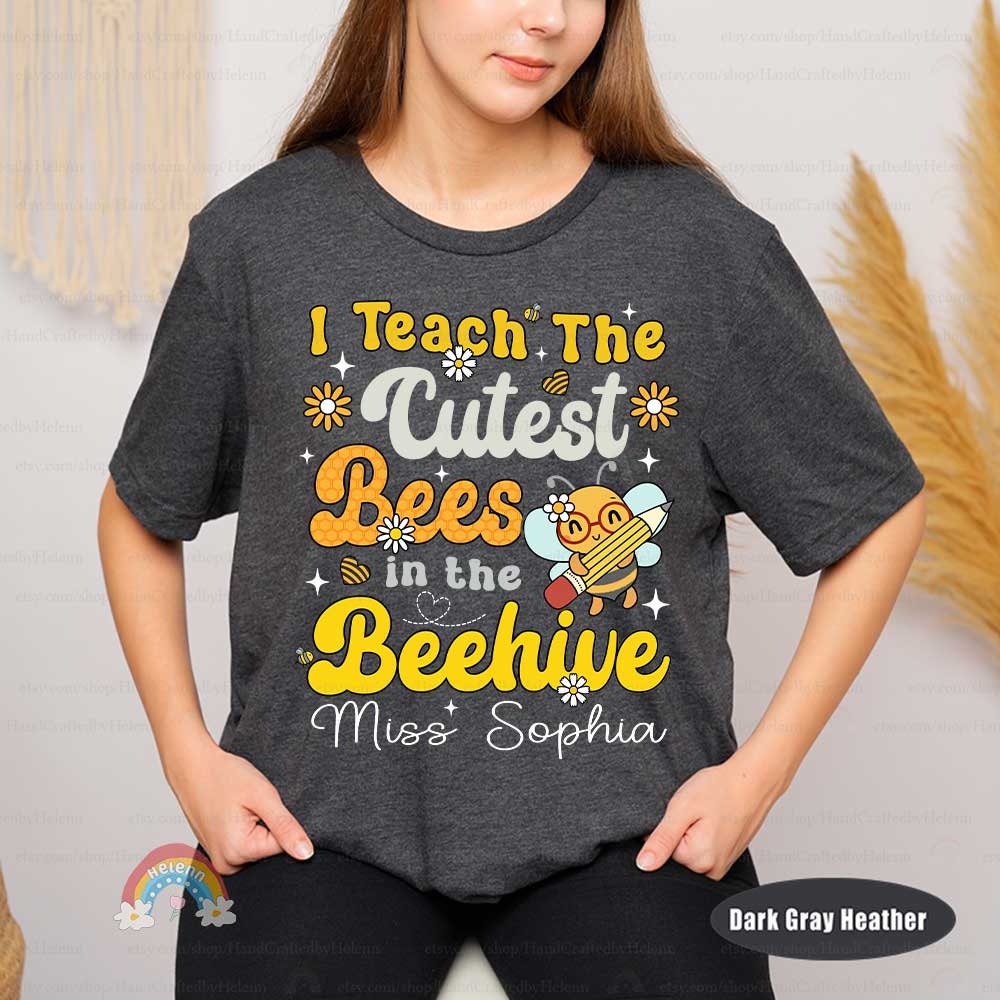 A creative and cute representation of a teaching theme, featuring a musically inclined bee character, vibrant yellow text, and decorative elements like flowers and a honeycomb heart.