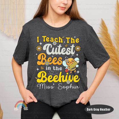 A creative and cute representation of a teaching theme, featuring a musically inclined bee character, vibrant yellow text, and decorative elements like flowers and a honeycomb heart.