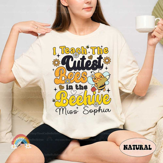 A creative and cute representation of a teaching theme, featuring a musically inclined bee character, vibrant yellow text, and decorative elements like flowers and a honeycomb heart.