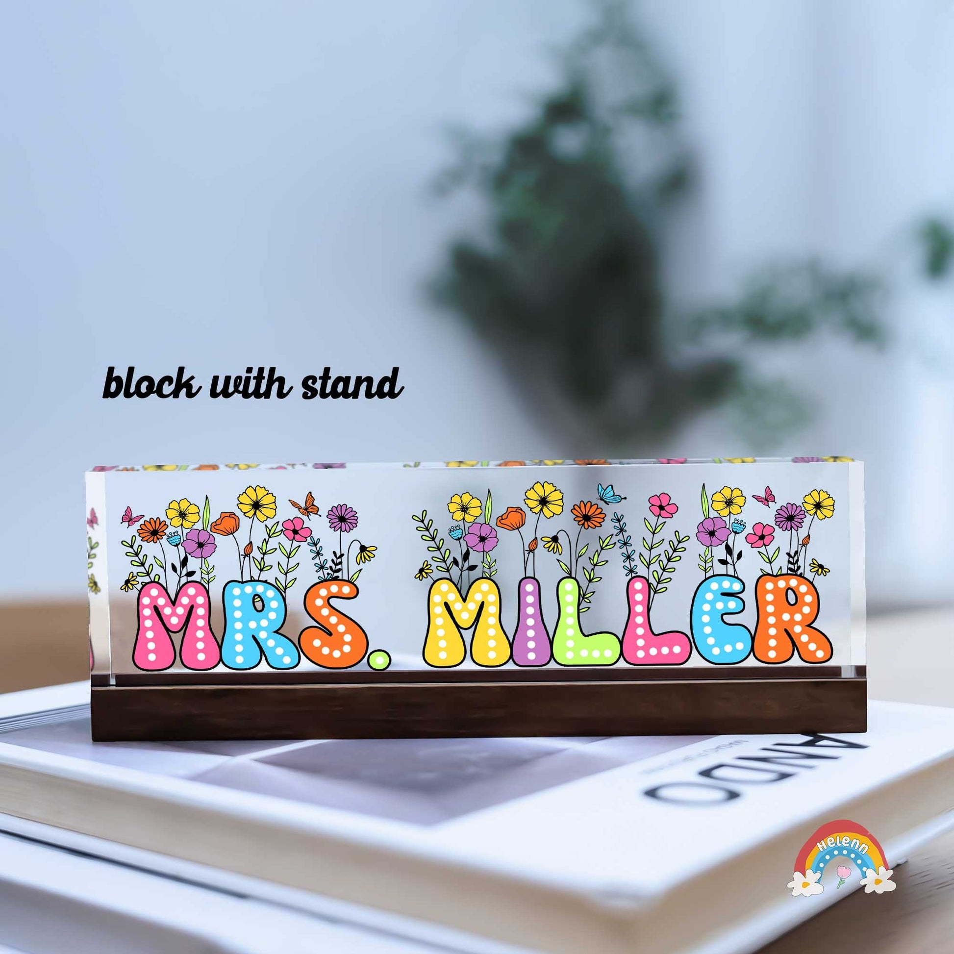 The design features the name MRS. MILLER set against a black background, with each letter individually styled in vibrant, eye-catching colors and playful polka dot patterns, creating a lively and engaging visual appeal.