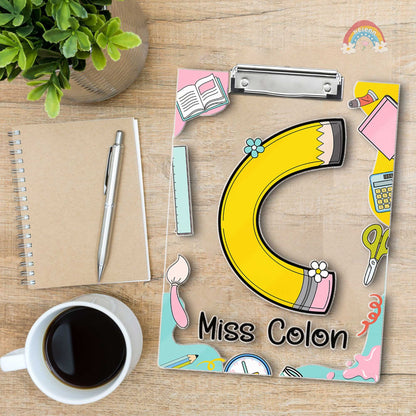 A playful and educational design featuring the letters S and B on decorated clipboards Each letter has a unique pattern and the clipboards are enhanced with items like books and pencils along with the teacher&#39;s name at the bottom