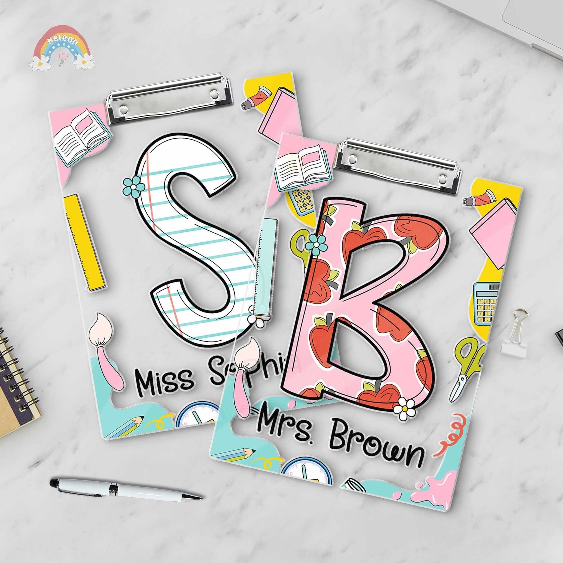 A playful and educational design featuring the letters S and B on decorated clipboards Each letter has a unique pattern and the clipboards are enhanced with items like books and pencils along with the teacher&#39;s name at the bottom