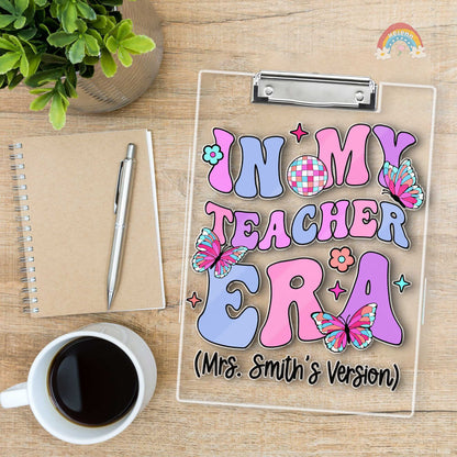 A custom teacher&#39;s clipboard designed with a bright and cheerful color palette, displaying Mrs. Smith&#39;s version of her teaching era, decorated with floral elements and lively butterfly illustrations.