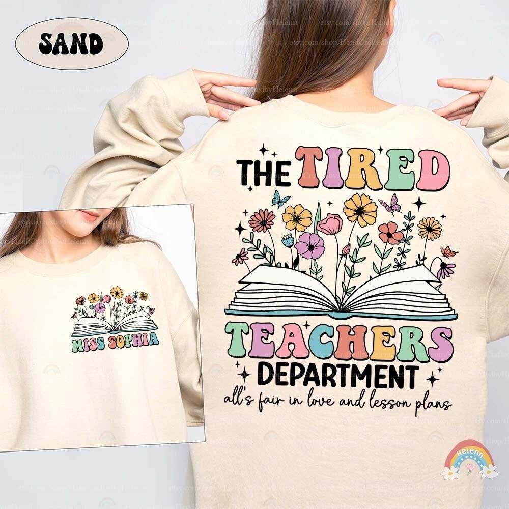 A playful yet expressive design that captures the exhaustion of teaching with TIRED TEACHERS written in bold, colorful letters, underscored by floral and butterfly motifs which add a touch of whimsy and brightness to the theme.