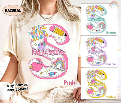 An attractive layout with the name set against a backdrop of school-themed illustrations including a rainbow and stars, perfect for a teacher with a lively personality.