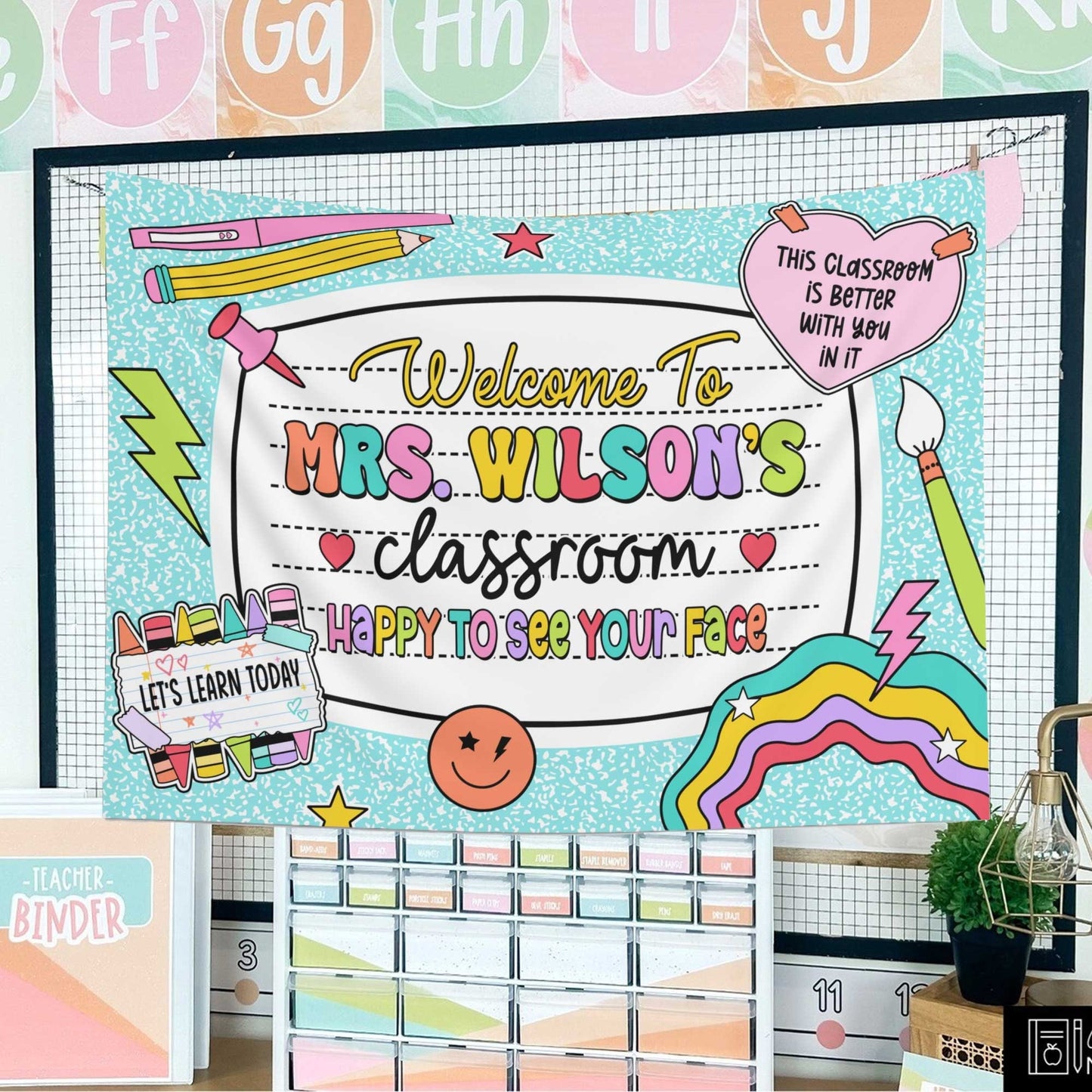 The design showcases a black-and-white notebook pattern with bold, pastel-colored text and fun classroom-themed illustrations.
