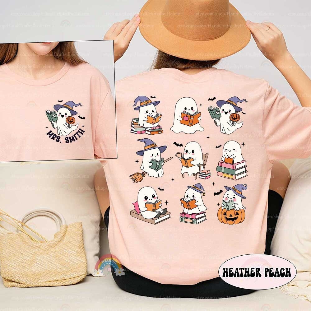 A fun and spooky design showcasing two ghosts enjoying books among pumpkins and bats The phrase It&#39;s a good day to read a boooook is written in colorful letters capturing the Halloween spirit