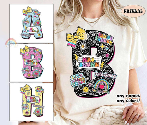 A playful design with bold letters in various colors such as pink black blue yellow and green Each letter is adorned with fun elements like bows rainbows and smiley faces along with the teacher's name
