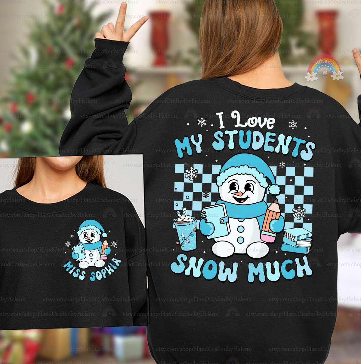 Cute and cozy design with a smiling snowman dressed for winter, holding school supplies and surrounded by snowflakes. The phrase I Love My Students Snow Much brings warmth and holiday cheer to the classroom.