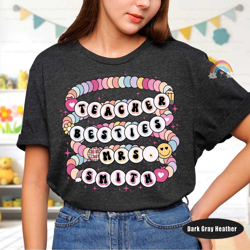 Creatively designed tee showcasing teacher names in a beaded letter style, symbolizing the connection between colleagues. Bright colors and intricate details make this design a perfect way to celebrate