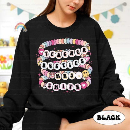 Bright and cheerful design bringing to life the friendship between teachers through colorful beaded-style lettering. The personalized names add a trendy and heartwarming touch, perfect for showcasing a strong teaching partnership.