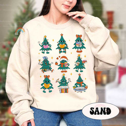 This vibrant holiday T-shirt shows a series of Christmas tree characters with books, pencils, and holiday accents, adding a fun and educational twist to seasonal celebrations.