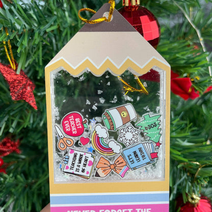 Cheerful and fun tag-shaped ornament with shakeable snow, decorated with cute school-themed icons like scissors, books, and a holiday tree. The personalized message for Mrs. Smith adds a thoughtful and festive touch.