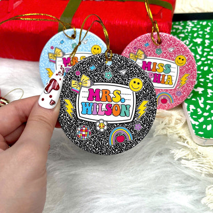 These vibrant, notebook-inspired ornaments feature teacher names in bold, colorful letters surrounded by fun classroom-themed icons such as bows, globes, and smiley faces. Perfect for adding a personalized and joyful touch to the holiday season.