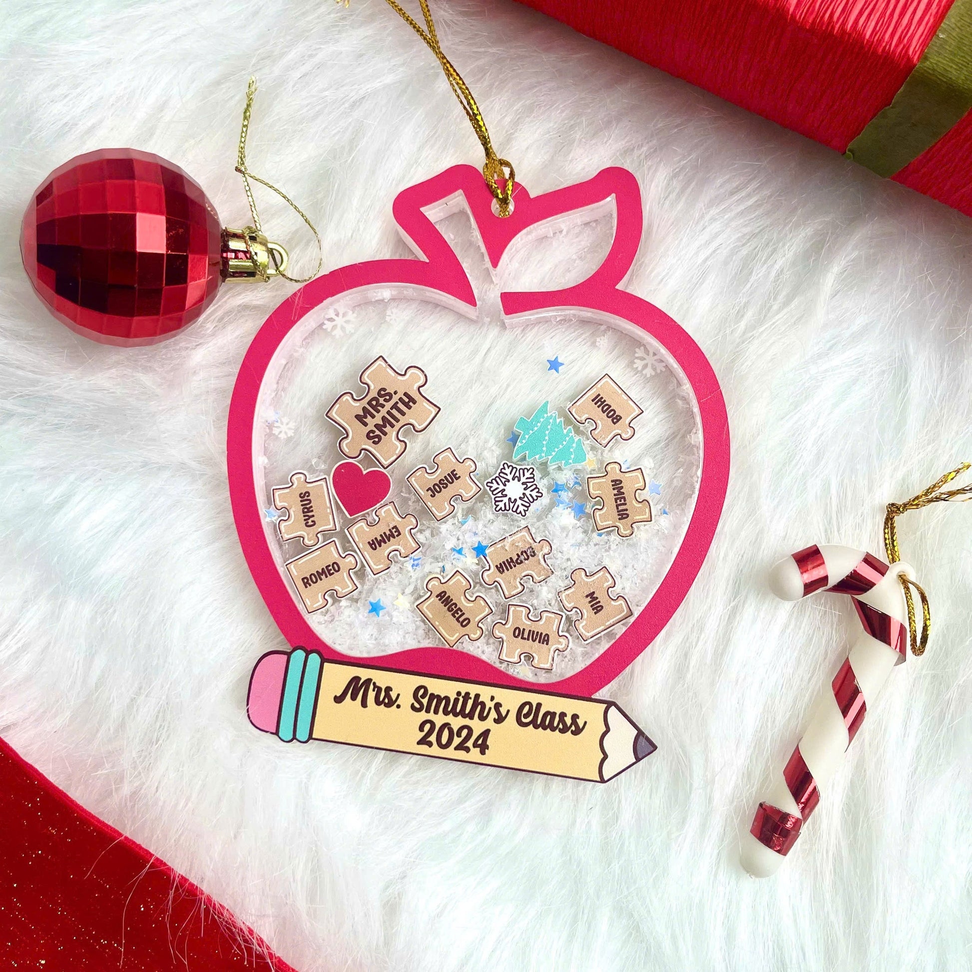 Playful and festive apple-shaped ornament with student names engraved on puzzle pieces, celebrating Mrs. Smith’s Class of 2024. The shakeable snow inside adds a fun and interactive holiday touch.