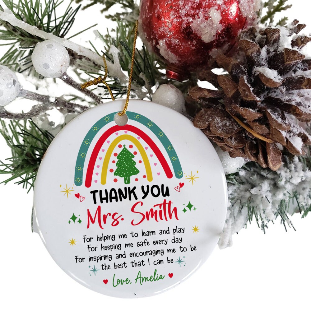 Festive ornament with a rainbow and Christmas tree, expressing gratitude to Mrs. Smith for her dedication. Personalized with a thank-you message from Love, Amelia, it’s a thoughtful gift for the holidays.