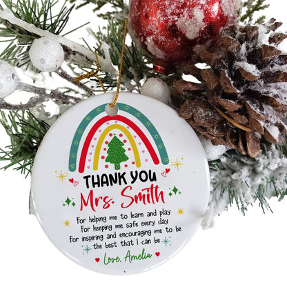 Festive ornament with a rainbow and Christmas tree, expressing gratitude to Mrs. Smith for her dedication. Personalized with a thank-you message from Love, Amelia, it’s a thoughtful gift for the holidays.