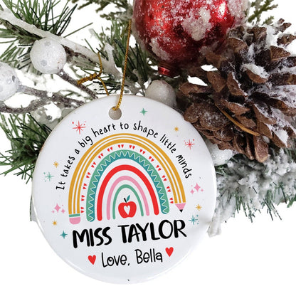 Festive ornament showcasing a colorful rainbow and a sweet message of appreciation for Miss Taylor. The personal note from Love, Bella makes it a meaningful holiday gift for any teacher.