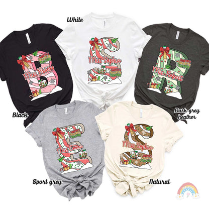 Whimsical and colorful design with a large, festive letter personalized with the teacher’s name, decorated with holiday items like stockings, ribbons, and presents. Ideal for spreading holiday cheer in the classroom.