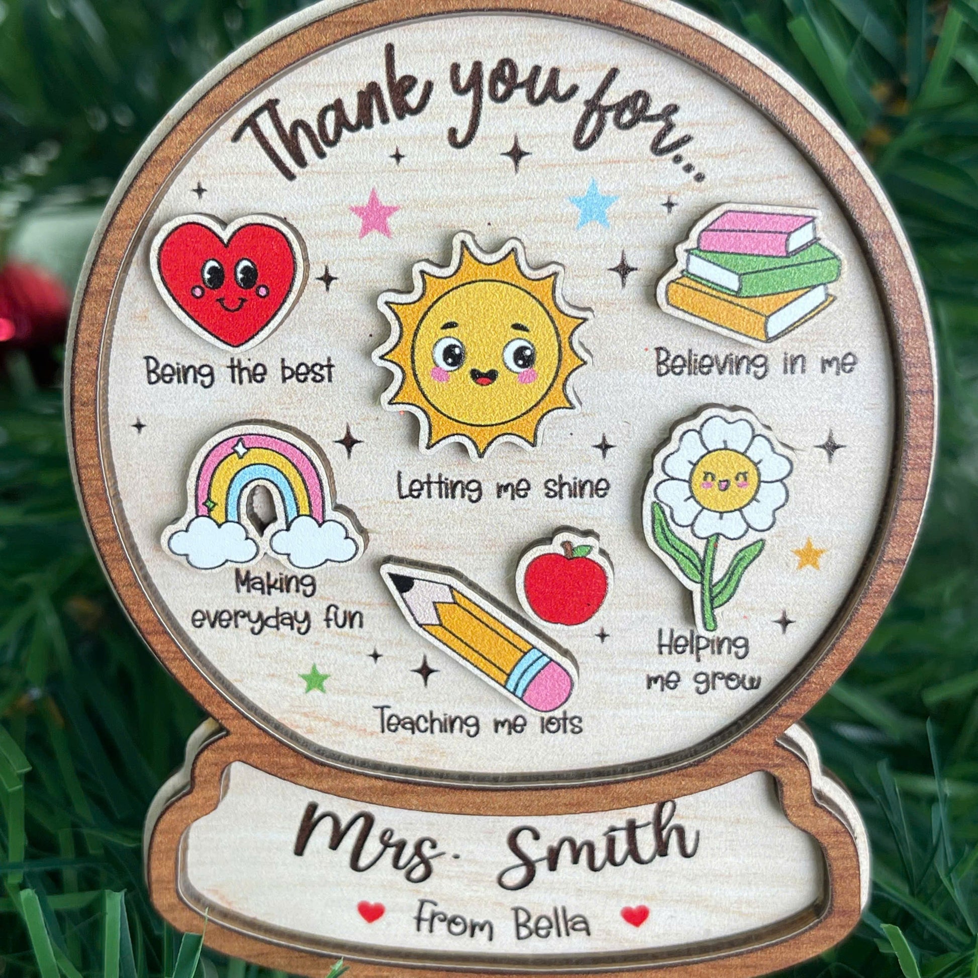 Playful and thoughtful ornament featuring a thank-you message to Mrs. Smith, personalized from Bella. With cute icons like a sun and pencil, it’s a perfect teacher appreciation gift for the holidays.