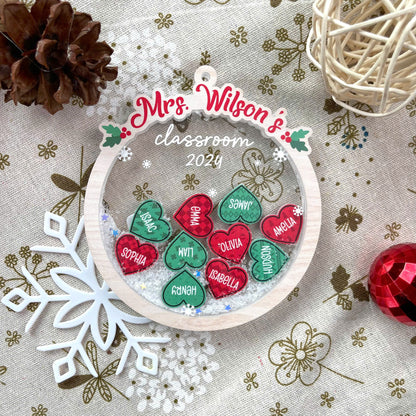 Charming holiday ornament displaying Mrs. Wilson’s classroom with student names in festive red and green hearts. Perfect for celebrating the 2024 class.