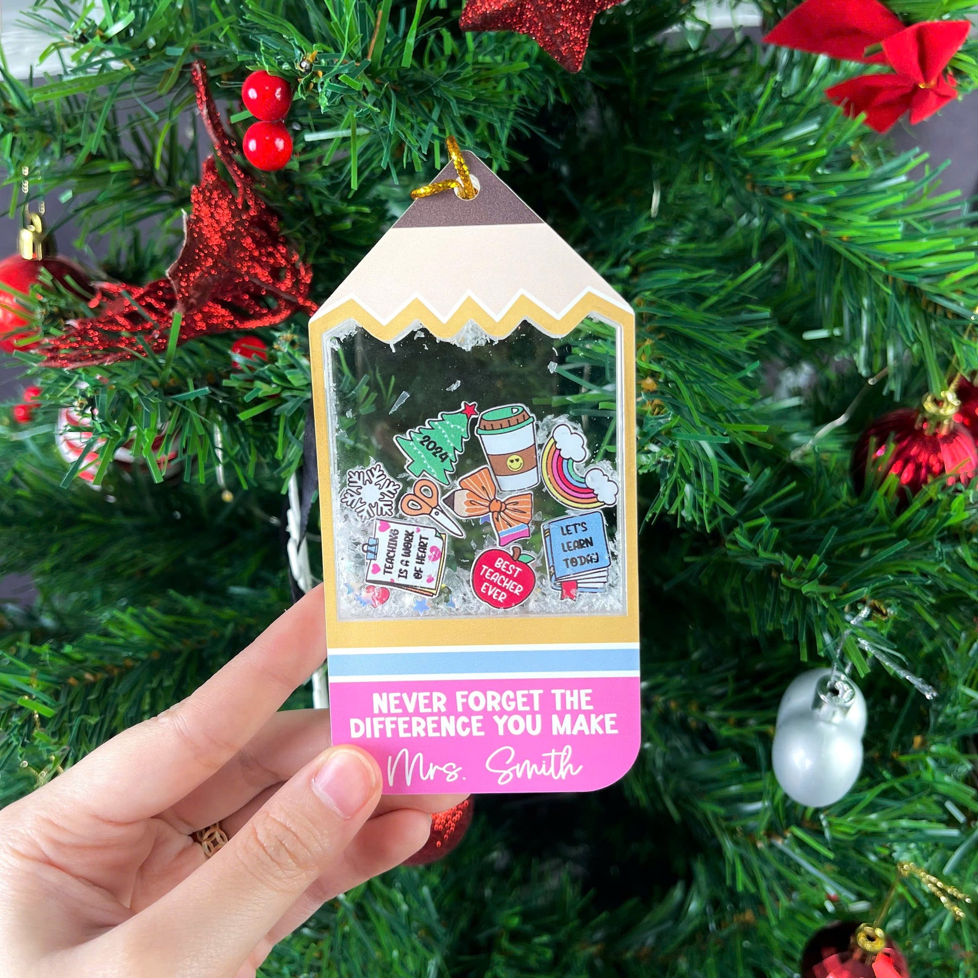 Playful tag-shaped ornament with a personalized message for Mrs. Smith, featuring fun icons and a shakeable snow effect. The phrase Never Forget the Difference You Make makes it a thoughtful teacher appreciation gift.