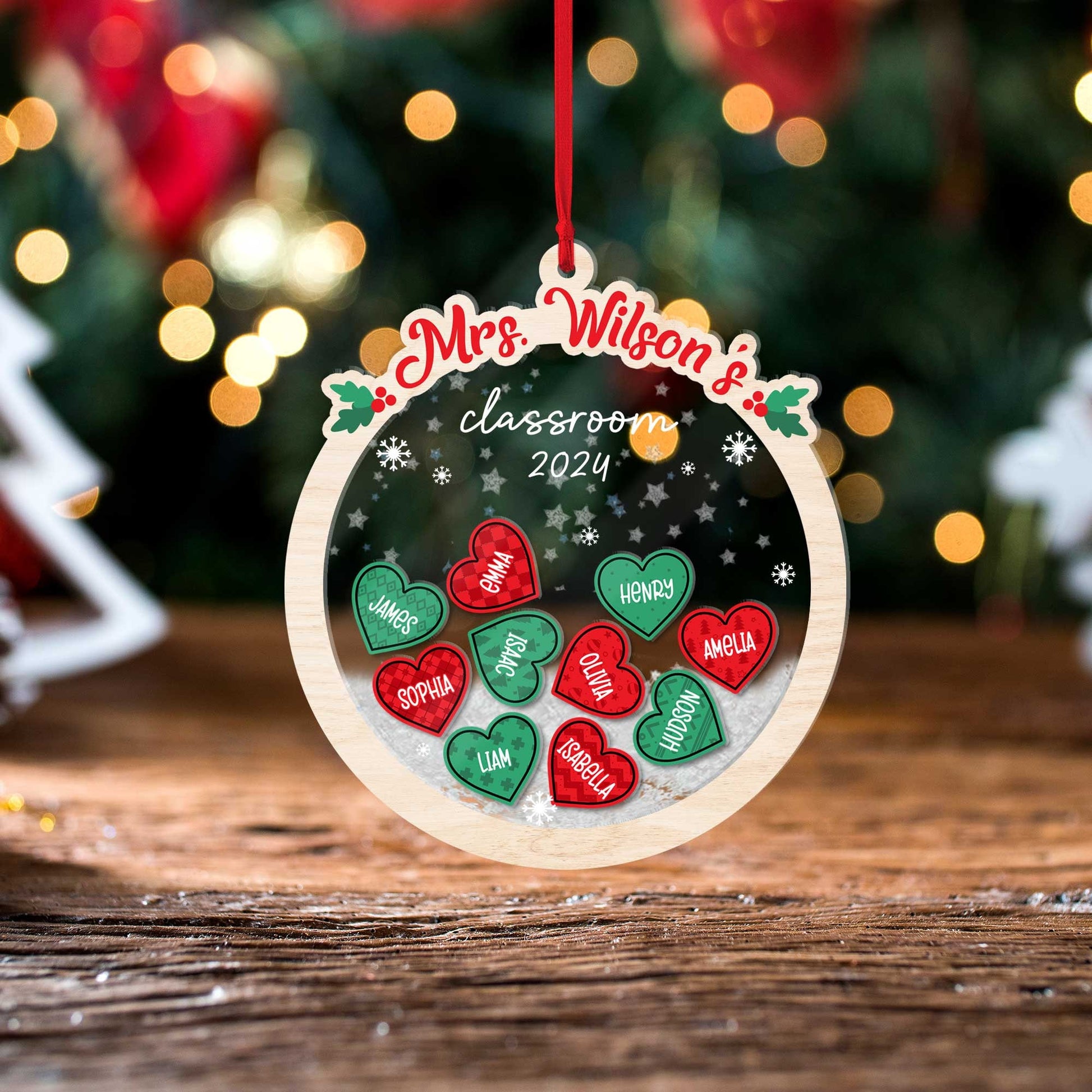 Playful round ornament featuring heart-shaped student names, personalized for Mrs. Wilson’s classroom in 2024. The shakeable design makes it a delightful addition to any holiday decor.
