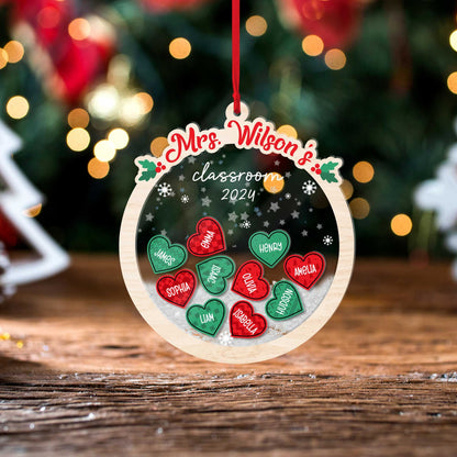 Playful round ornament featuring heart-shaped student names, personalized for Mrs. Wilson’s classroom in 2024. The shakeable design makes it a delightful addition to any holiday decor.