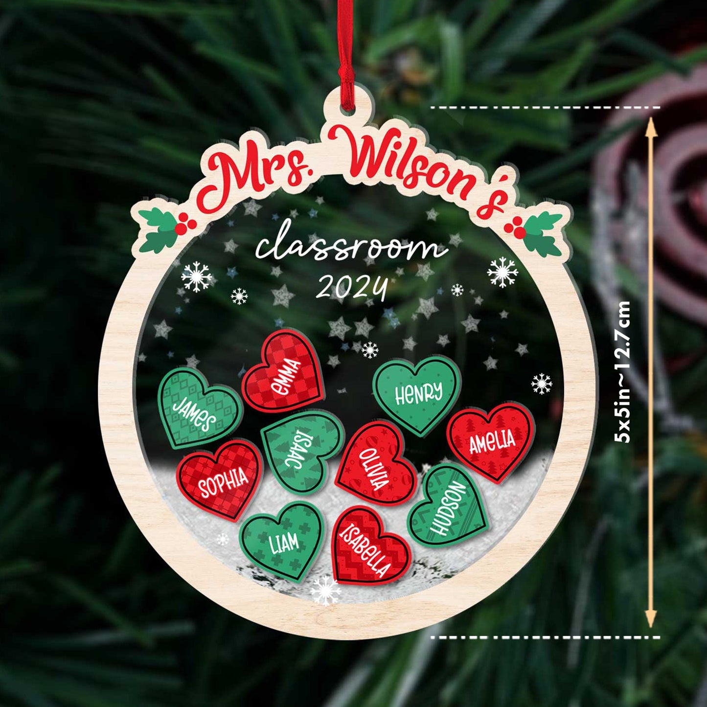 Whimsical ornament with heart-shaped student names, personalized for Mrs. Wilson’s classroom, surrounded by shakeable snowflakes. A unique and thoughtful keepsake for the 2024 holiday season.