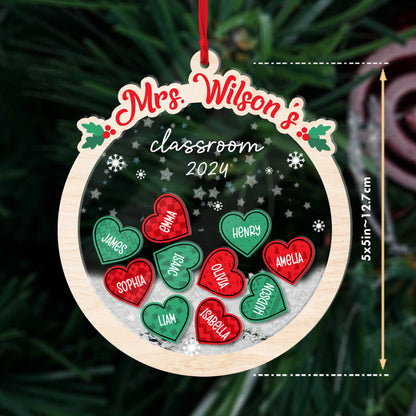 Whimsical ornament with heart-shaped student names, personalized for Mrs. Wilson’s classroom, surrounded by shakeable snowflakes. A unique and thoughtful keepsake for the 2024 holiday season.