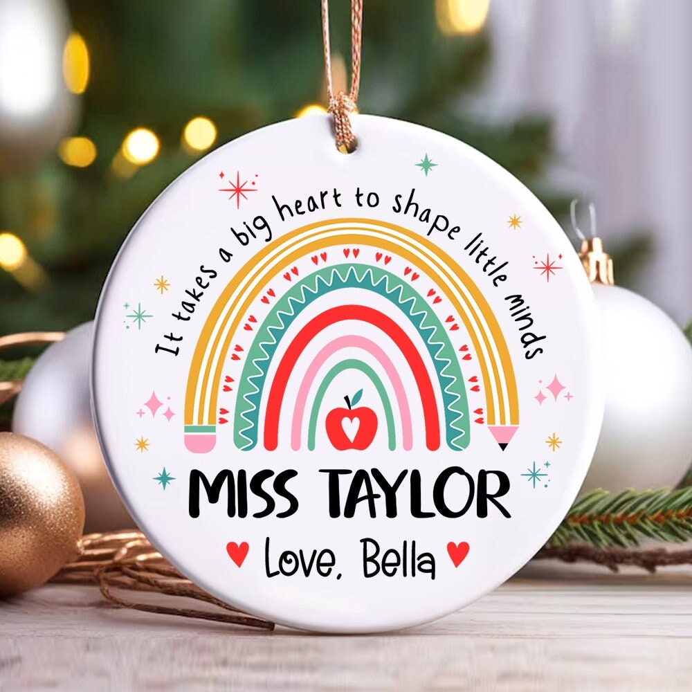 Bright and cheerful ornament featuring a colorful rainbow and the message It takes a big heart to shape little minds. Personalized with Miss Taylor’s name and Love, Bella, making it a perfect gift for teachers during the holiday season.