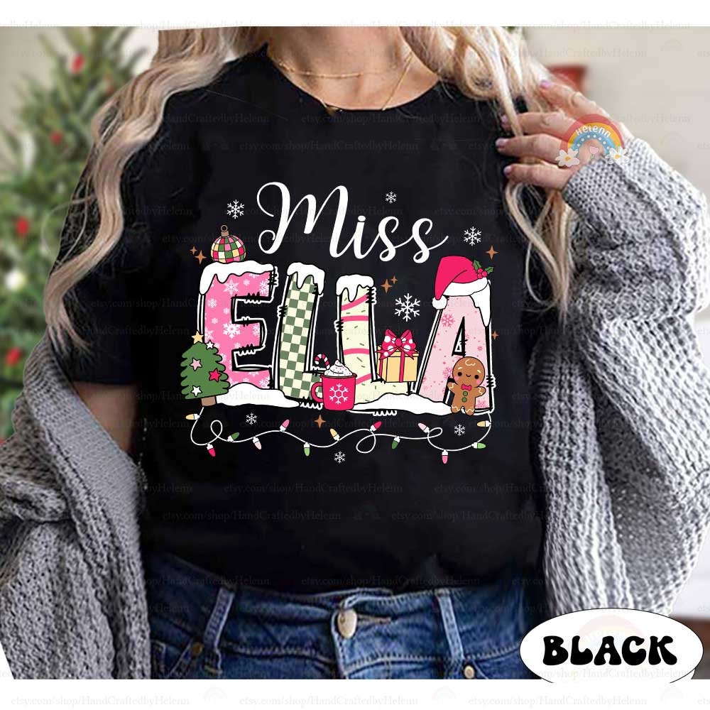 Fun and festive sweatshirt with Miss Ella’s name embellished with seasonal elements like a Santa hat, snow, and a gingerbread man, making it an ideal holiday outfit for teachers.