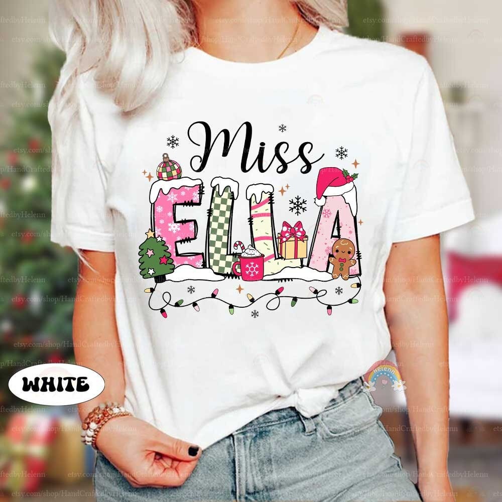 Bright and playful design featuring Miss Ella’s name decked out with holiday-themed decorations, including Christmas lights and snowflakes. A perfect personalized gift for the holiday season.