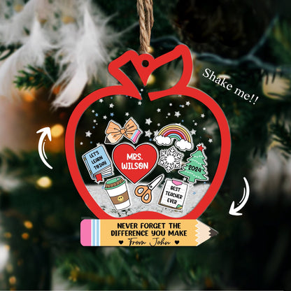 Playful and thoughtful ornament shaped like an apple with holiday-themed elements, including a personalized heart for Mrs. Wilson. With fun details like a snowflake and a pencil, this shakeable ornament is a perfect keepsake for teachers.