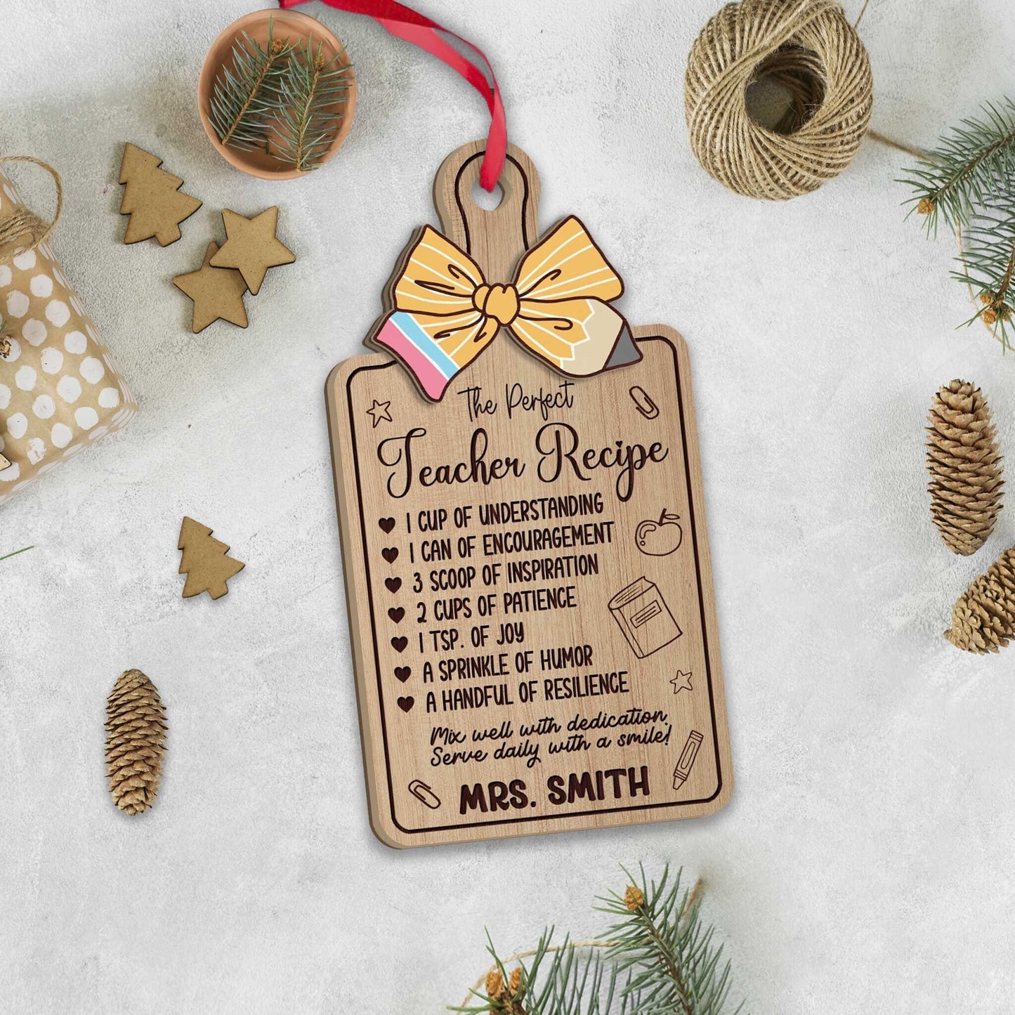 Charming ornament shaped like a recipe board, listing the ingredients for the perfect teacher, such as understanding, patience, and joy. Personalized with Mrs. Smith’s name, making it a thoughtful holiday gift.