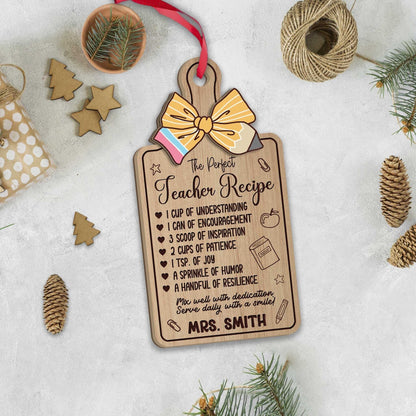Charming ornament shaped like a recipe board, listing the ingredients for the perfect teacher, such as understanding, patience, and joy. Personalized with Mrs. Smith’s name, making it a thoughtful holiday gift.